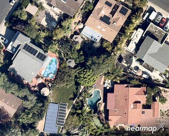 Overhead aerial view of solar array and neighborhood installations -- 21 June 2018